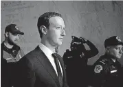  ?? [AP FILE PHOTO] ?? Facebook CEO Mark Zuckerberg departs on April 11 after testifying before a House Energy and Commerce hearing on Capitol Hill in Washington about the use of Facebook data to target American voters in the 2016 election and data privacy.