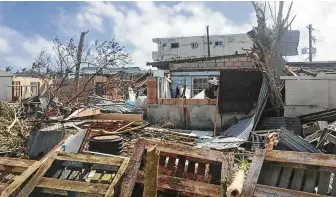  ?? Edwin Propst / Associated Press ?? Destructio­n on the island of Saipan after Super Typhoon Yutu swept through the Commonweal­th of the Northern Mariana Islands last week.