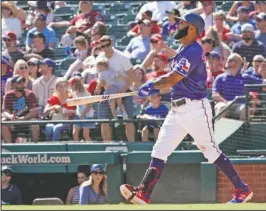  ?? The Associated Press ?? IT’S OUTTA HERE: Texas Rangers Danny Santana watches the flight of his grand slam during the fifth inning of Thursday’s game against the Boston Red Sox in Arlington, Texas.