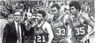  ?? THE COMMERCIAL APPEAL ?? Memphis State coach Gene Bartow, Larry Finch (21), Ronnie Robinson (33) and Larry Kenon (35) at the Final Four in St. Louis in 1973.