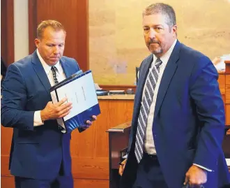  ?? ADOLPHE PIERRE-LOUIS/JOURNAL ?? Bernalillo County Sheriff’s Sgt. David Priemazon, left, talks with attorney Sam Bregman on Monday. Priemazon is accused of beating a man during an arrest.