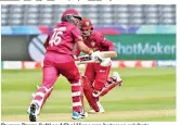  ??  ?? Darren Bravo (left) and Shai Hope run between wickets