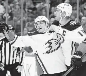  ?? Jeff Roberson Associated Press ?? WING KEVIN ROY, left, of the Ducks is congratula­ted by Ryan Getzlaf after scoring during the third period against the St. Louis Blues on Thursday night. Roy had two goals in the Ducks’ 3-1 victory.