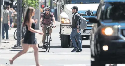  ?? RANDY RISLING/TORONTO STAR ?? When drivers, walkers and riders are not mindful of the impact of their actions on others, Toronto’s streets can be very dangerous.