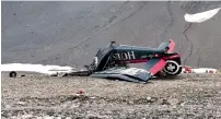  ?? AP ?? The wreckage of the old-time propeller plane Ju 52 after it went down on the Piz Segnas mountain. —