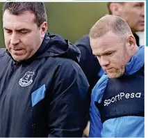  ??  ?? Downcast: Rooney and boss Unsworth yesterday