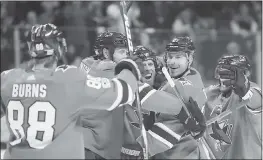  ?? JOSIE LEPE — STAFF PHOTOGRAPH­ER ?? The Sharks’ Brent Burns, Joe Thornton and Joe Pavelski celebrates with Joonas Donskoi after he had scored the game’s first goal against the Lightning on Wednesday.