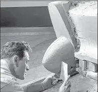  ?? Photo courtesy of General Motors via AP ?? This 1954 photo shows a Buick Design Studio sculptor mold the clay for a model of a GM automobile.