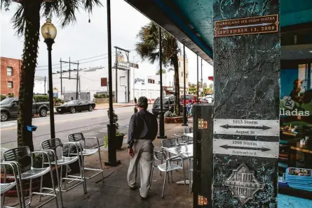  ?? Michael Ciaglo / Staff photograph­er ?? Galveston restaurant­s, like Taquilo’s Tex-Mex Cantina, commemorat­e the city’s track record of devastatin­g storms with plaques marking the high waters they caused. Hurricane Ike gifted O’Malley’s Stage Door Pub similar memorabili­a, like a forgotten wall.