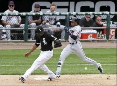  ?? ANNIE RICE — THE ASSOCIATED PRESS ?? The Indians’ Greg Allen reaches first as White Sox relief pitcher Juan Minaya is unable to handle the throw from first baseman Jose Abreu during the eighth inning. Yan Gomes scored on the play. Minaya was charged with an error.