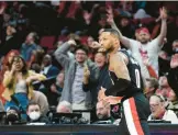  ?? STEVE DYKES/AP ?? Damian Lillard scored 71 points in the Trail Blazers’ 131-114 victory over the Rockets on Sunday, tying three others for the eighth-most points in an NBA game.