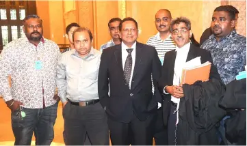  ??  ?? Dr Streram (front centre) with his lawyer and others after the ruling at the Federal Court in Putrajaya. — Bernama photo