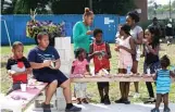  ?? KEVIN TANAKA/FOR THE SUN-TIMES ?? Neighbors attend a Mothers Against Senseless Killings block party in 2018.