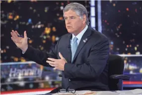  ?? FRANK FRANKLIN II/AP, FILE ?? On Fox News Channel on Monday, host Sean Hannity looked straight into the camera to deliver a clear message: “It absolutely makes sense for many Americans to get vaccinated. I believe in science. I believe in the science of vaccinatio­ns.” Yet he followed up his statement with a segment appealing to people skeptical of the immunizati­on push.