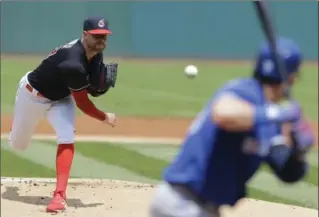  ?? TONY DEJAK, THE ASSOCIATED PRESS ?? Indians starting pitcher Corey Kluber delivers to Toronto Blue Jays’ Josh Donaldson in the first inning Sunday in Cleveland. Kluber struck out a season-high 14 in an easy victory for Cleveland over Toronto.