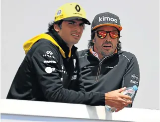  ?? /Getty Images ?? Renault link: Fernando Alonso, right, and Carlos Sainz, who is on a one-year loan to Renault from Red Bull.