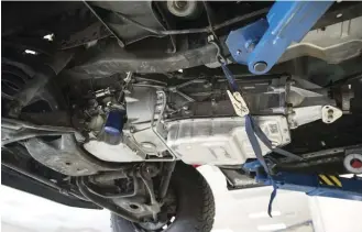  ??  ?? ABOVE. THIS SQUARE-BODY SUBURBAN IS MID-SWAP (IT’S GETTING A SUPERCHARG­ED 6.2L LSA ENGINE). THE 6L90E TRANSMISSI­ON WILL FIT NICELY BUT REQUIRES A NEW, CUSTOM CROSS MEMBER. NO, THE BLUE STRAP IS NOT THE NEW CROSS MEMBER.
