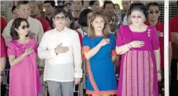  ?? AFP PHOTO ?? APO REMEMBERED
Former senator Ferdinand “Bongbong” Marcos Jr. (2nd L), his sister Imee (2nd R) and their mother, Imelda Marcos (R), listen to the national anthem during a wreath-laying ceremony at a monument to former President Ferdinand Marcos during...