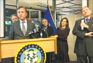  ?? Dan Haar / Hearst Connecticu­t Media ?? Gov. Ned Lamont, with Lt. Gov. Susan Bysiewicz, right, rolled out his transporta­tion plan earlier this month in Hartford.