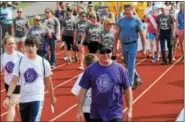  ??  ?? Hundreds take to the track for the team lap at Pottsgrove High School Saturday morning.