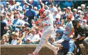  ?? TERRENCE ANTONIO JAMES/CHICAGO TRIBUNE ?? Cardinals first baseman Paul Goldschmid­t hits a three-run home run in the third inning against the Cubs on Friday.