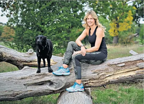  ??  ?? Jog on: Labrador Storm has been a constant companion for Marina Fogle as she battled her pain