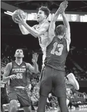  ?? Danny Moloshok Associated Press ?? JULES BERNARD, a reserve guard for UCLA, goes up for a shot against Purdue Fort Wayne.