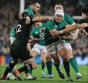  ??  ?? MOMENTOUS: (clockwise frommain) Jacob Stockdale lets out a roar as his team-mates pile on after his try; Rory Best has his path cleared by Cian Healy; Johnny Sexton and Devin Toner hug each other after the final whistle at Lansdowne Road