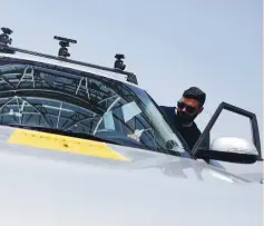  ?? (Nir Elias/Reuters) ?? A MAN ENTERS a Kia Soul, modified to be an autonomous vehicle by Imagry, ahead of a driving demonstrat­ion near Shefayim last month.