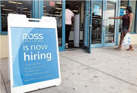  ?? WILFREDO LEE/AP ?? Friday’s jobs report showed the unemployme­nt rate shrank to 10.2%. Above, a help wanted sign in Florida in July.