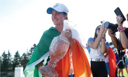  ??  ?? Leona Maguire with the Solheim Cup after starring in Europe’s upset win over the United States. Photograph: Maddie Meyer/Getty Images