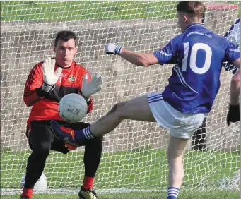  ??  ?? Stephen Campbell puts a shine on an already comfortabl­e victory forNaomh Mairtin as he scores past Kenneth Shevlin in the Dreadnots goal. Picture: Paul Connor
