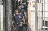  ?? RICK MAJEWSKI/FOR THE SUN-TIMES ?? Chicago firefighte­rs outside the home where eight children under 17 died Sunday in the 2200 block of South Sacramento.