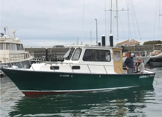  ??  ?? Top: Mike Komar and his fianceŽ aboard their 1999 Eastern 27, which they will cruise aboard on their honeymoon.