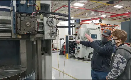  ?? SUBMITTED ?? A machining instructor teaches one of the Mentor High School interns at Component Repair Technologi­es, Inc. on Tyler Boulevard in Mentor.