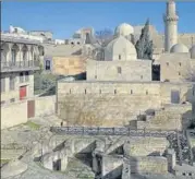  ??  ?? The Shirvanshi­r Palace and homes in Baku’s old city