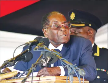  ??  ?? President Mugabe addresses mourners at the burial of Mai Maria Msika, widow of former Vice President Joseph Msika, at the National Heroes Acre in Harare yesterday