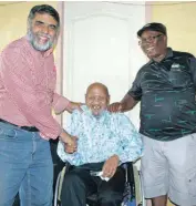  ?? PHOTO: BARRY VILJOEN ?? Westenburg resident Gabriel Knight, centre, receives a wheelchair from ANC ward councillor Hafiz Shaikh and chairperso­n of the ANC Win Rainbow Branch, Mashimpye Stuurman.