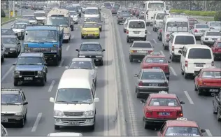  ??  ?? Vehicles come to a standstill on a highway in China, which granted 22.69 million driving licences last year. There are 236 million drivers in China with thousands seeking licences through training.