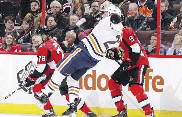  ?? JANA CHYTILOVA/GETTY IMAGES ?? Milan Lucic of the Edmonton Oilers takes a tumble courtesy of a hit by Ottawa Senators’ Bobby Ryan during Thursday’s game at the Canadian Tire Centre in Ottawa. The Oilers improved to 6-2-1 in their last nine games with their 6-2 rout of the Senators.