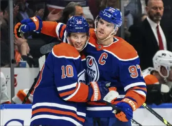  ?? Jason Franson/Canadian Press ?? NEXT UP Edmonton’s Connor McDavid, right, surpassed 800 career points with two goals and an assist Tuesday night in a 4-2 win against the Philadelph­ia Flyers. McDavid is the fifthfaste­st to reach 800 in NHL history (545 games). He and the Oilers will visit PPG Paints Arena Thursday night to face the Penguins (7 p.m.).