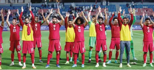  ?? ?? Qatar players celebrate after their win over Kuwait in the joint qualifiers for the FIFA World Cup 2026 and AFC Asian Cup 2027 on Tuesday.