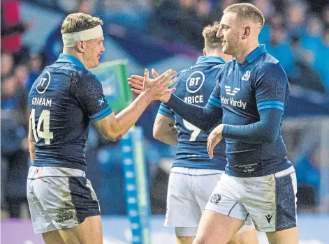  ?? ?? TRIUMPH: Scotland’s Darcy Graham, left, celebrates scoring a try with Finn Russell during the Argentina match.