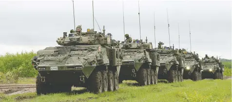  ?? SGT JEAN-FRANCOIS LAUZ / COMBAT CAMERA / GENERAL DYNAMICS ?? Canadian light armoured vehicles move in a convoy in the Wainwright Garrison training area during exercises there in 2016. The Defence Department has announced a new sole-source deal to buy 360 armoured vehicles from General Dynamics Land Systems Canada for $3 billion.