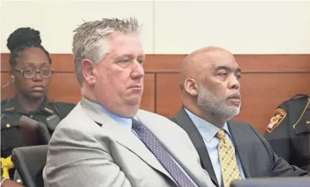  ?? BARBARA PERENIC/COLUMBUS DISPATCH ?? Andrew Mitchell, right, a former Columbus police vice officer, appears with defense attorney Mark Collins at his trial this week. Mitchell is charged with murder for the shooting death of 23-year-old Donna Castleberr­y in August 2018. He is the first Columbus officer to have been charged with an on-duty shooting in recent years.