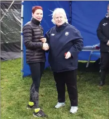  ??  ?? Karen Costello being presented with her medal by Georgina Drumm, President Athletics Ireland.