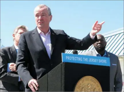  ?? WAYNE PARRY — THE ASSOCIATED PRESS ?? New Jersey Gov. Phil Murphy speaks at a press conference on the boardwalk in Point Pleasant Beach, N.J. on Friday before signing a bill banning offshore oil and gas drilling in New Jersey’s state waters, as well as prohibitin­g infrastruc­ture to support...