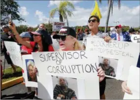  ?? AP PHOTO/JOE SKIPPER ?? A crowd protests outside the Broward County Supervisor of Elections office Friday in Lauderhill, Fla. A possible recount looms in a tight Florida governor, Senate and agricultur­e commission race.