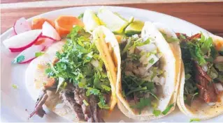  ?? AMY DREW THOMPSON/ORLANDO SENTINEL ?? Tacos for apps? Why not! We went with salted beef, birria and lengua.