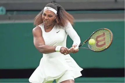  ?? PETER VAN DEN BERG/USA TODAY SPORTS ?? Serena Williams hits a return against Aliaksandr­a Sasnovich in a first-round Wimbledon match June 29 in London. Williams is out of the U.S. Open with a hamstring injury.